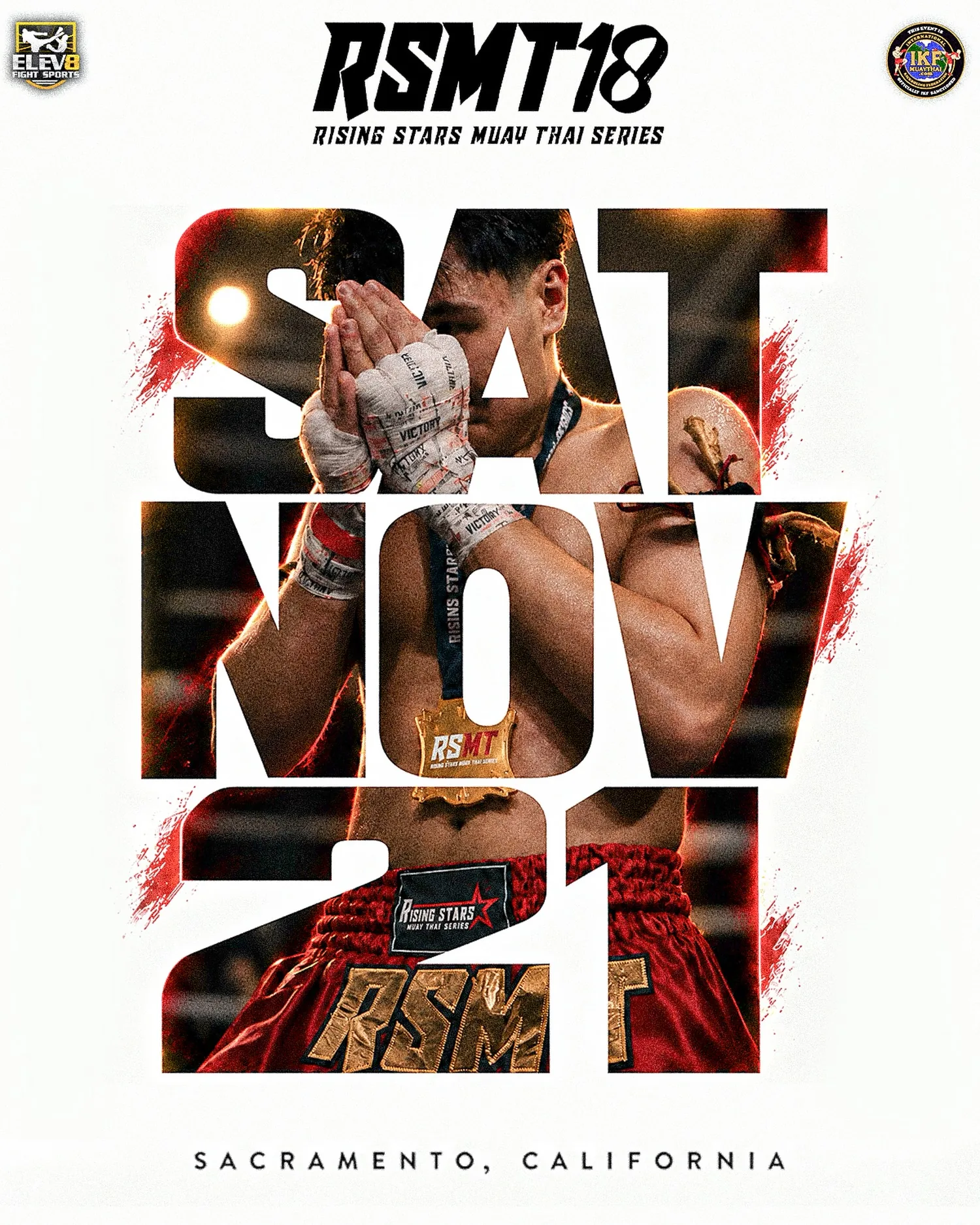 RSMT 18 poster — Rising Stars Muay Thai Series, Saturday November 21, Sacramento, California. A fighter in red RSMT trunks and Victory hand wraps, wearing an RSMT medal, performs a wai inside giant SAT NOV 21 letters. IKF sanctioned.