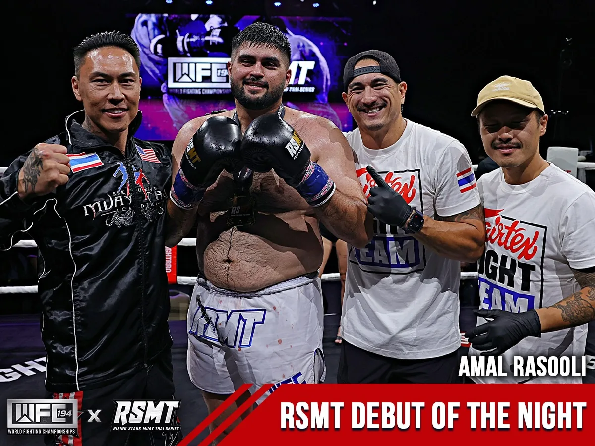 WFC 194 x RSMT RSMT Debut of the Night graphic: Amal Rasooli poses in the ring with members of his team after his win.